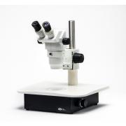 Stereo microscope with led illuminated base and articulating mirror
